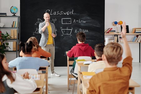 A student asking a question to satisfy his curiosity.